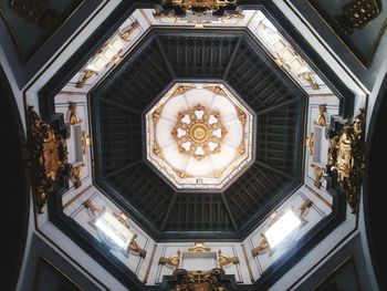 Low angle view of illuminated chandelier in building