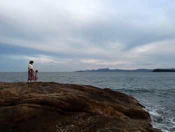 Scenic view of sea against cloudy sky