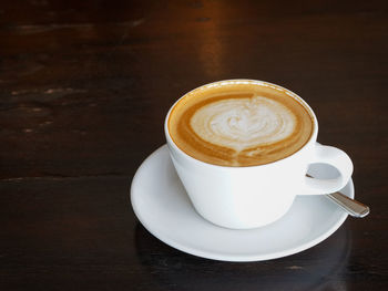 Close-up of coffee cup on table
