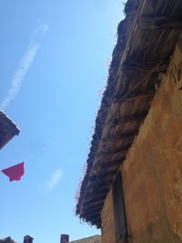 Low angle view of built structure against blue sky