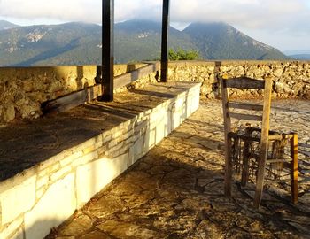 Steps leading towards mountain range against sky