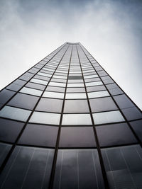 Low angle view of modern office building against sky