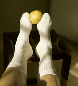 Low section of woman wearing shoes