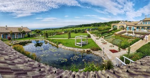 High angle view of lake and buildings against sky