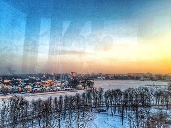 Snow covered landscape at sunset