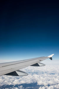 Airplane flying over blue sky