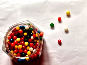 High angle view of multi colored candies on table