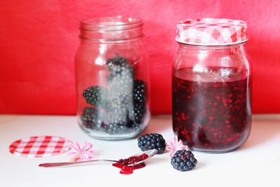 Close-up of drink in glass jar on table