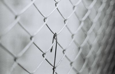 Full frame shot of chainlink fence against sky