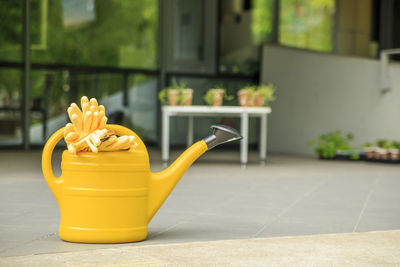 Close-up of yellow flower on table