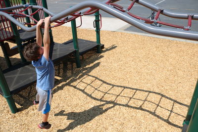 High angle view of boy playing in playground