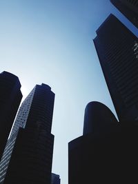 Low angle view of buildings against blue sky