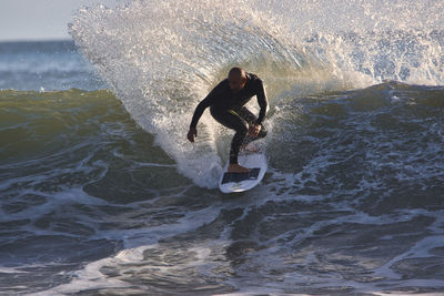 Man surfing in sea