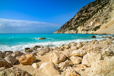 Scenic view of sea against blue sky