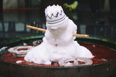 Close-up of snowman on table