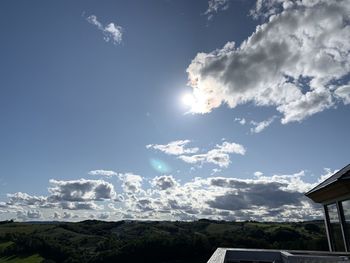 Low angle view of buildings against sky on sunny day