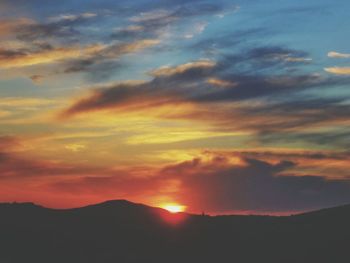 Scenic view of mountains against sky during sunset