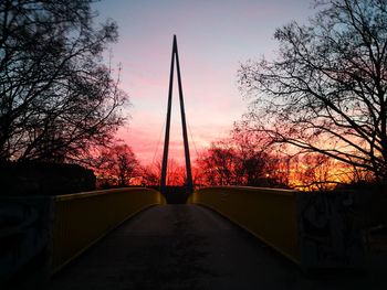 Silhouette bridge against sky during sunset