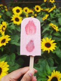 Close-up of hand holding ice cream cone