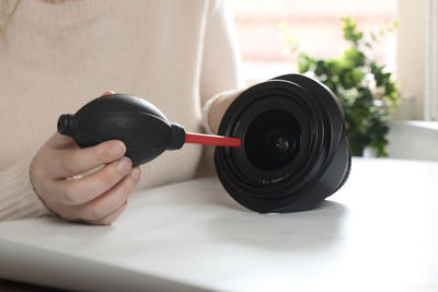 Cropped hand of man holding equipment