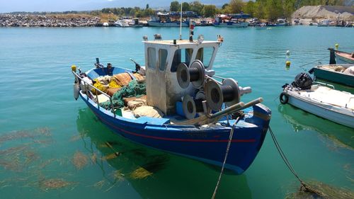 Boats moored in water