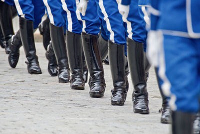 Low section of people in costume on road