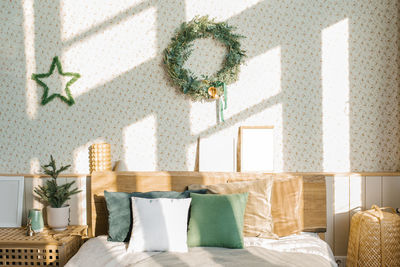 Christmas and new year composition. a scandinavian bedroom with light bed linen and bright pillows