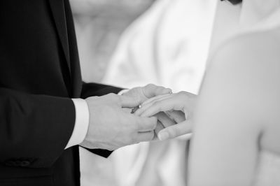 Close-up of couple holding hands