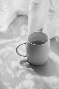 High angle view of coffee cup on table