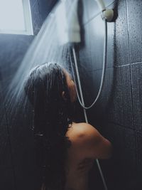 Portrait of woman in bathroom at home