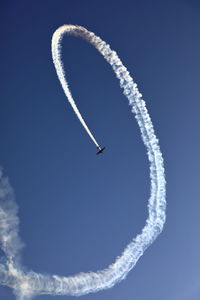 Low angle view of vapor trail against sky