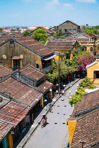 High angle view of street amidst buildings in town