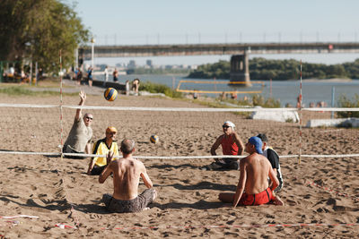 Group of people sitting on beach