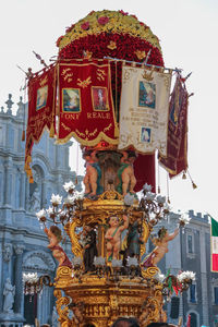 Low angle view of statue against temple