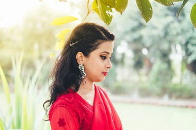 Portrait of young woman looking away