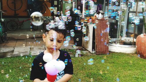 High angle view of woman holding bubbles