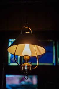 Close-up of illuminated lamp at home