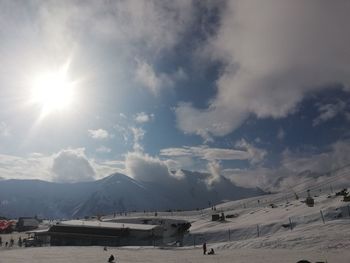 Panoramic view of snowcapped mountains against sky