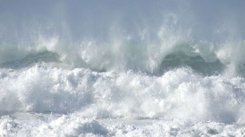 Waves splashing on rocks