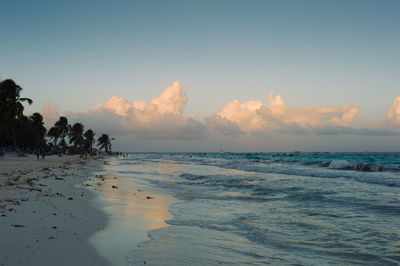 Scenic view of beach against sky during sunset