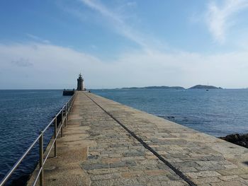 Pier over sea against sky