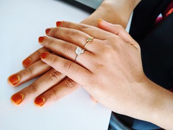 Midsection of couple holding hands