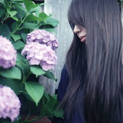 Woman looking at flowers