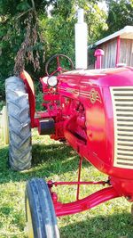 Red cart on grass