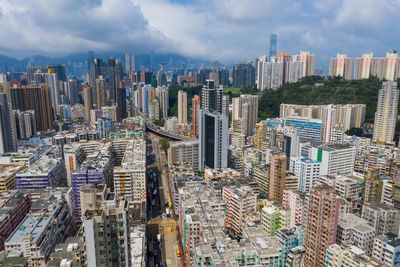 Aerial view of modern buildings in city against sky