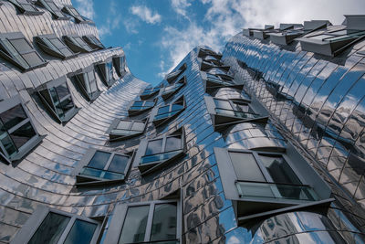 Low angle view of modern buildings against sky
