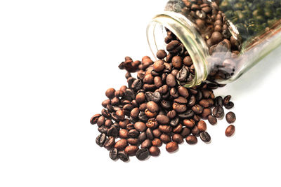 Close-up of coffee beans against white background