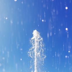 Fountain display against sky during daytime