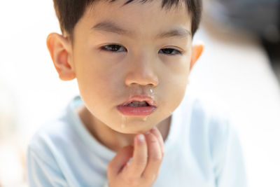 Portrait of cute boy eating