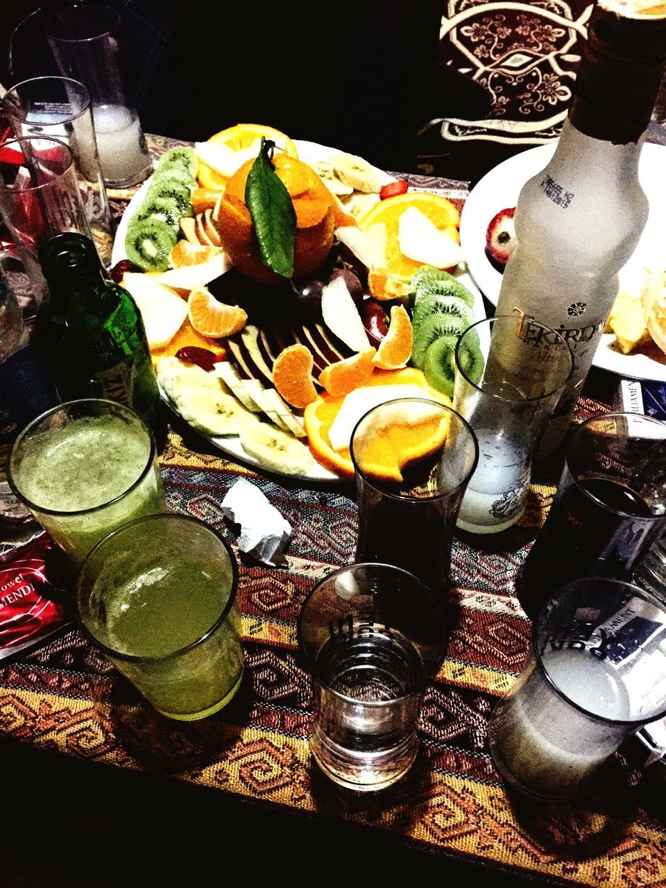 food and drink, indoors, freshness, still life, variation, food, table, high angle view, choice, close-up, large group of objects, container, abundance, drinking glass, drink, arrangement, bottle, bowl, glass - material, sweet food